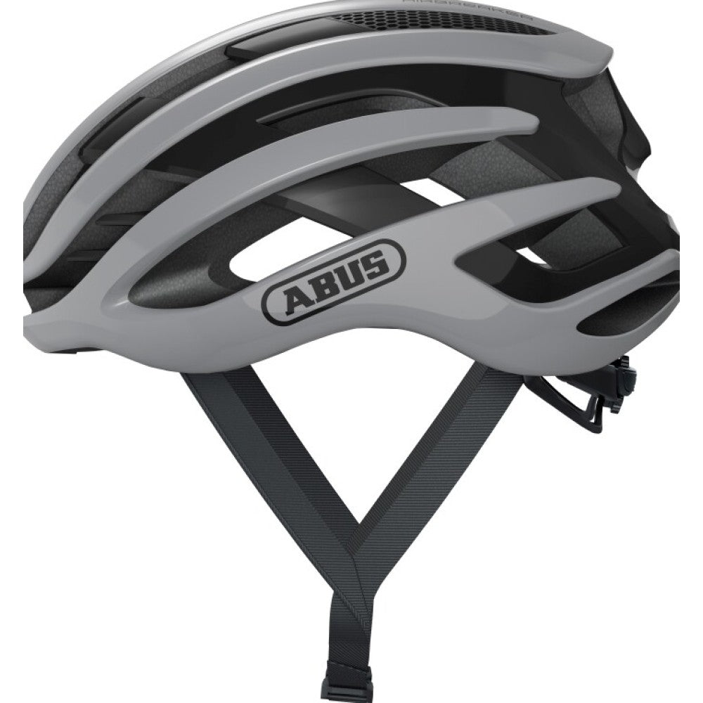 Abus AirBreaker landevejshjelm i grå, set fra siden, på hvid baggrund. Let, komfortabel og aerodynamisk hjelm til dig, der kører racercykel