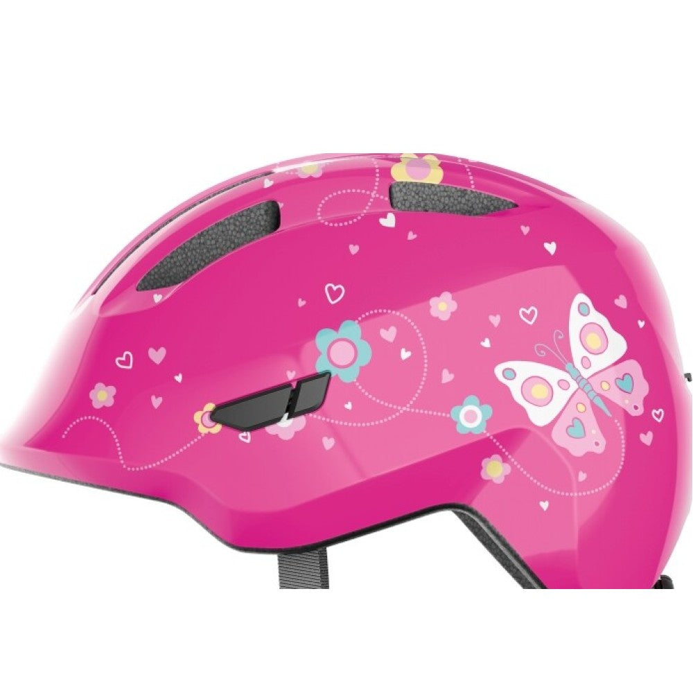 Abus Smiley 3.0 i pink. Smart, sikker og komfortabel cykelhjelm til børn. Fås i 2 størrelser. Kvalitet og sikkerhed fra verdenskendte tyske Abus